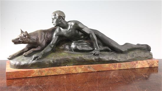 L. Riché. An Art Deco bronze group of a hunter and hound stalking their prey, 27in. H.10.5in.